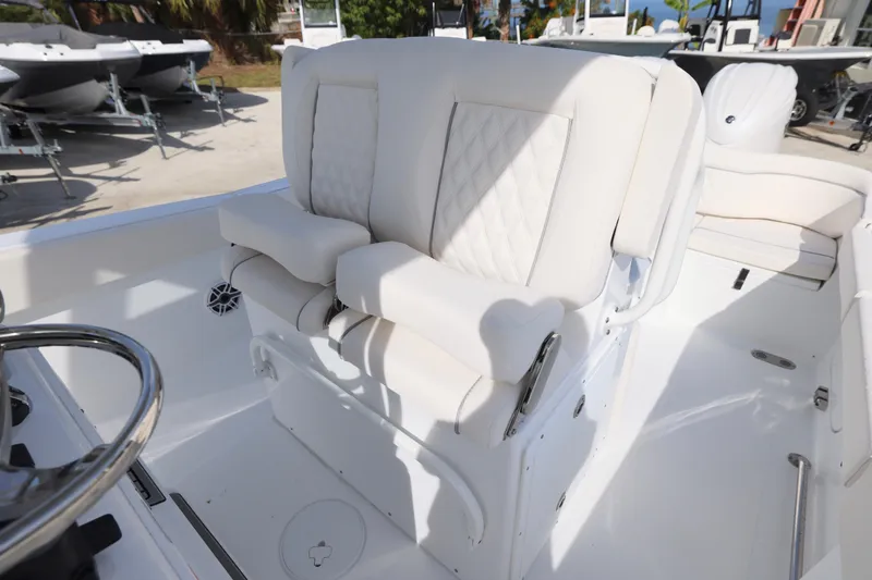 Slide: The Image of Luxurious seating on 2026 Sea Hunt Ultra 265 SE boat, featuring white upholstery and armrests. - 15