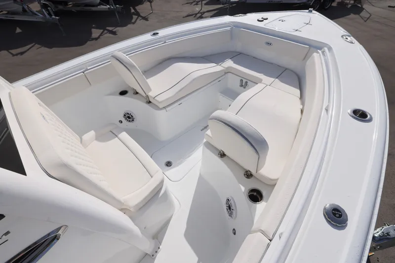 Slide: The Image of 2026 Sea Hunt Ultra 265 SE boat interior with white seating and modern design. - 2