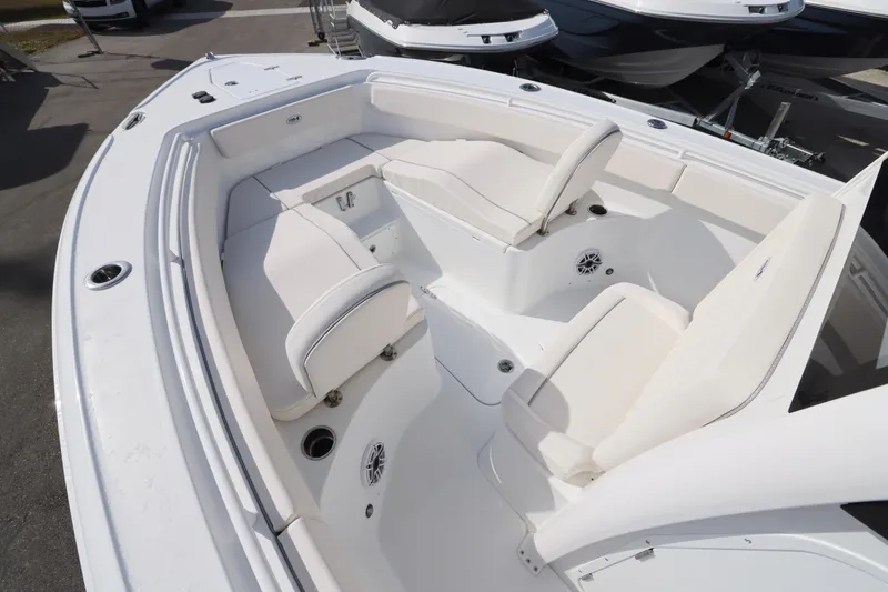 Slide: The Image of 2026 Sea Hunt Ultra 265 SE boat interior with white seating and modern design. - 22