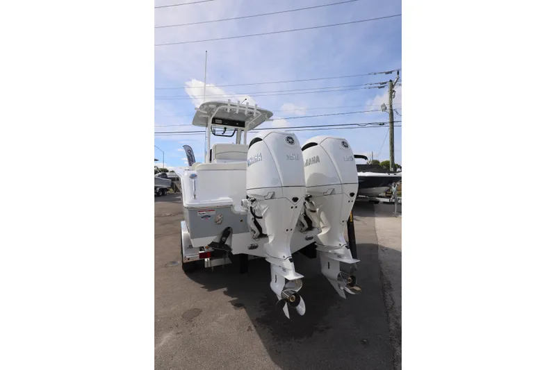 Slide: The Image of 2026 Sea Hunt Ultra 265 SE boat with dual Yamaha outboard engines. - 24