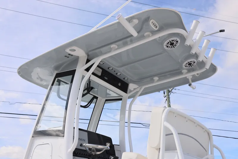 Slide: The Image of 2026 Sea Hunt Ultra 265 SE boat with T-top and rod holders. - 26
