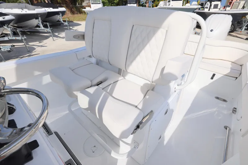 Slide: The Image of Luxury seating on 2026 Sea Hunt Ultra 265 SE boat, featuring white cushioned seats. - 6