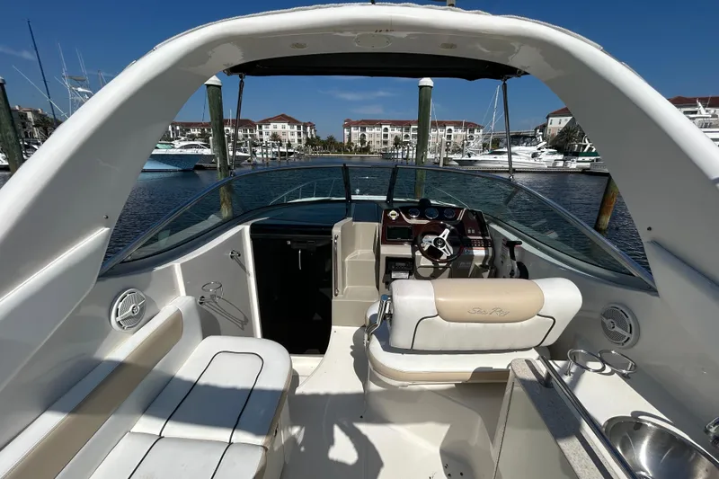 Slide: The Image of 2010 Sea Ray Sundancer 260 bathroom with sink, toilet, and porthole windows. - 103
