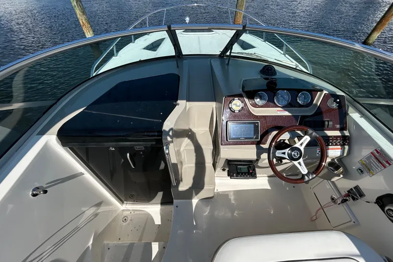 Slide: The Image of Interior of 2010 Sea Ray Sundancer 260 boat bathroom with sink and window. - 105