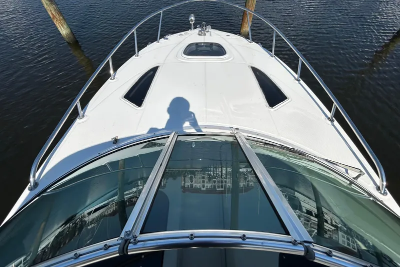 Slide: The Image of Storage compartment inside a 2010 Sea Ray Sundancer 260 boat, featuring coiled hose. - 109