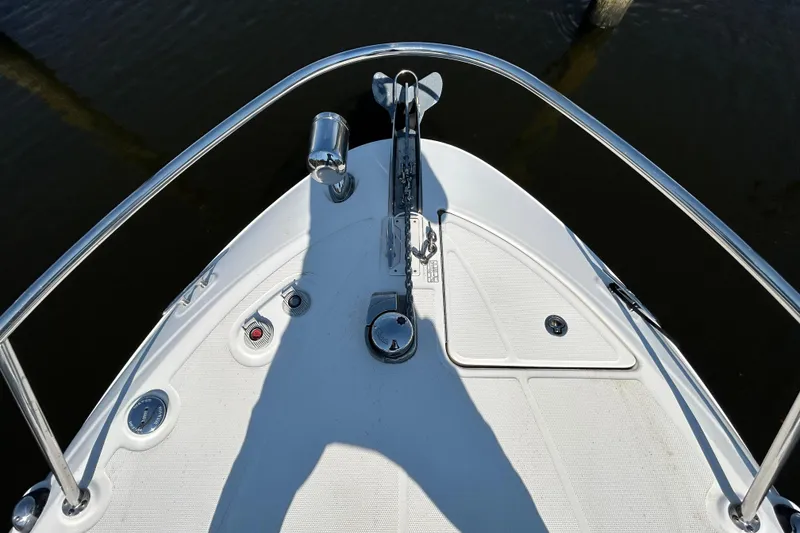 Slide: The Image of Open wooden cabinet inside 2010 Sea Ray Sundancer 260 boat, showcasing storage space. - 113