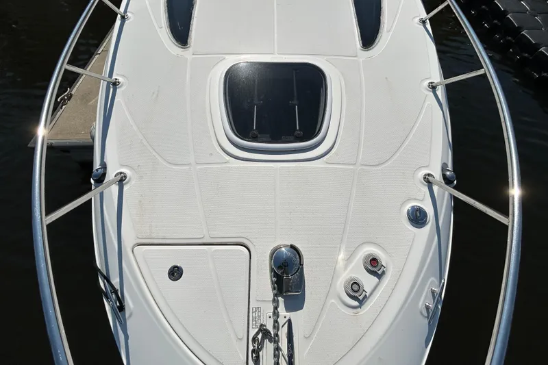 Slide: The Image of Open wooden storage compartment on a 2010 Sea Ray Sundancer 260 boat. - 117