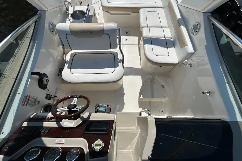 Slide: The Image of Open drawer in 2010 Sea Ray Sundancer 260 cabin with wooden flooring. - 126