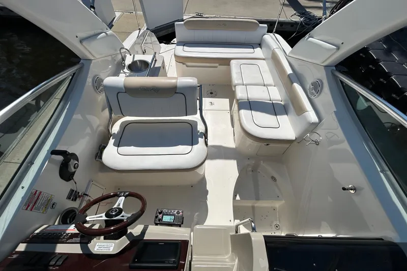 Slide: The Image of Microwave inside 2010 Sea Ray Sundancer 260 boat cabin, open door, wood paneling. - 127