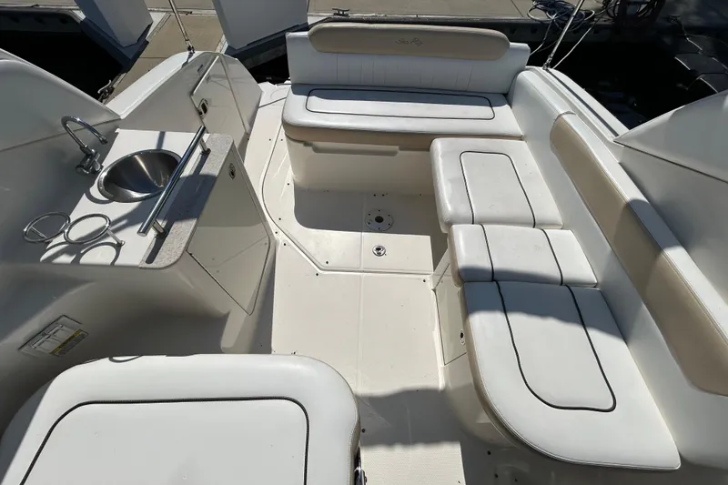 Slide: The Image of Interior of 2010 Sea Ray Sundancer 260 with wooden cabinetry and countertop. - 129