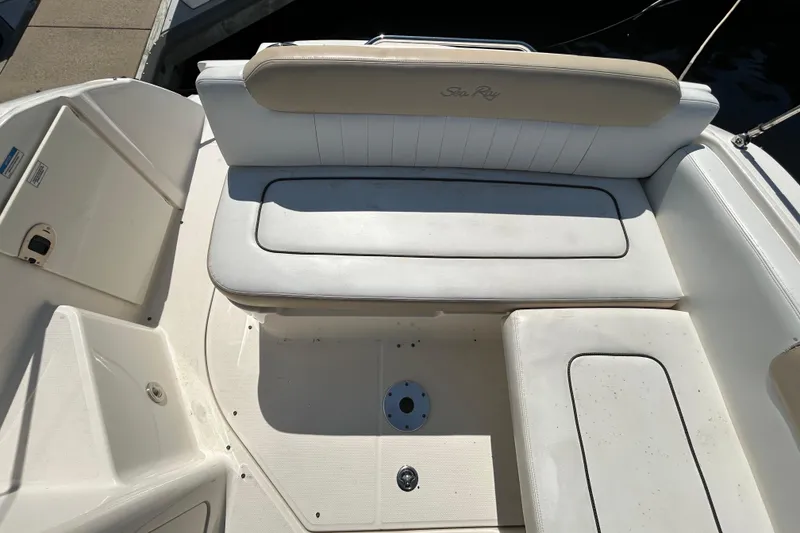 Slide: The Image of 2010 Sea Ray Sundancer 260 interior cabinet with control panel and storage compartments. - 130