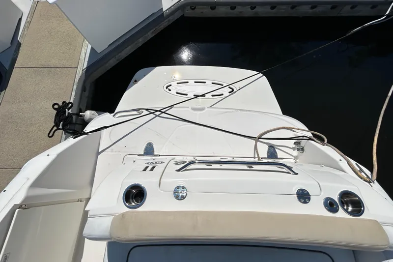 Slide: The Image of Electrical control panel on a 2010 Sea Ray Sundancer 260 boat, featuring AC and DC switches. - 131