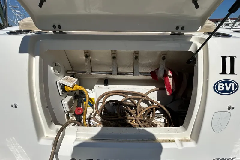 Slide: The Image of Main DC breaker panel on 2010 Sea Ray Sundancer 260 boat, featuring various switches and controls. - 133