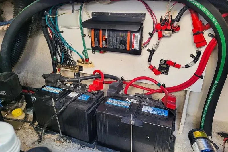 Slide: The Image of Electrical system of a 2010 Sea Ray Sundancer 260 boat, featuring batteries and wiring. - 18