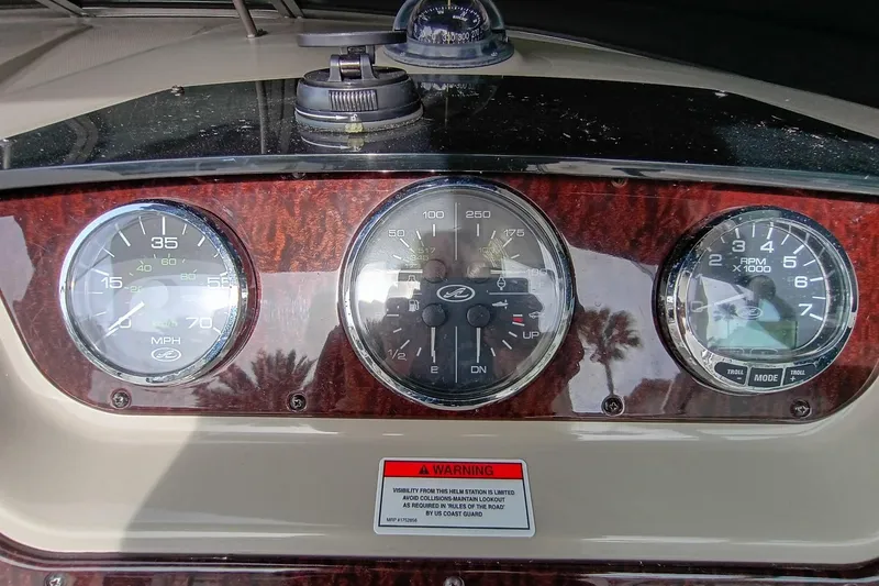 Slide: The Image of Dashboard of 2010 Sea Ray Sundancer 260 with speedometer, tachometer, and compass. - 24