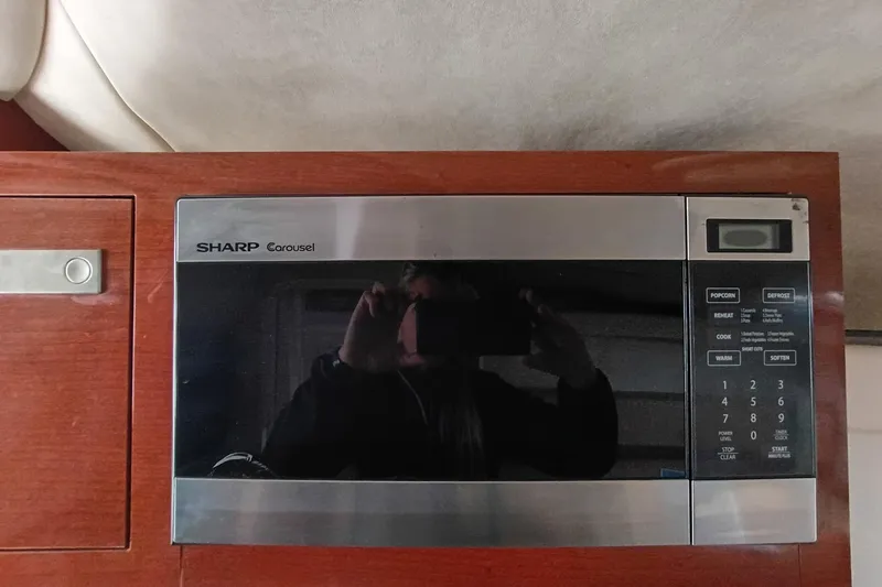 Slide: The Image of Sharp Carousel microwave in 2010 Sea Ray Sundancer 260 boat interior. - 33