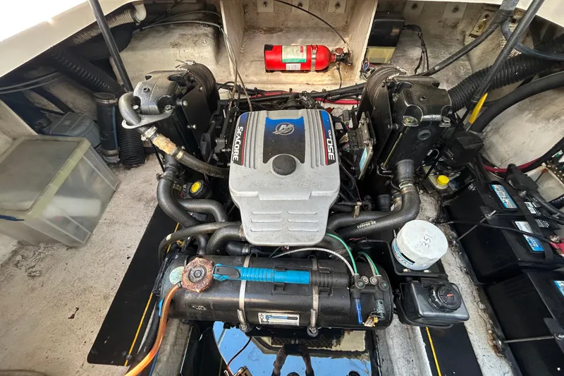 Slide: The Image of White cushioned seating on a 2010 Sea Ray Sundancer 260 boat. - 50