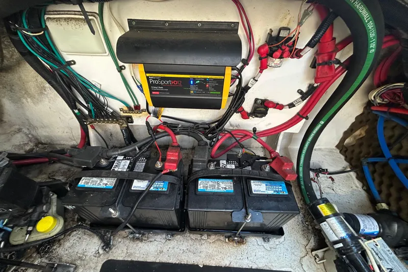 Slide: The Image of Storage compartment on a 2010 Sea Ray Sundancer 260 with life jackets and MarineMax gear. - 52