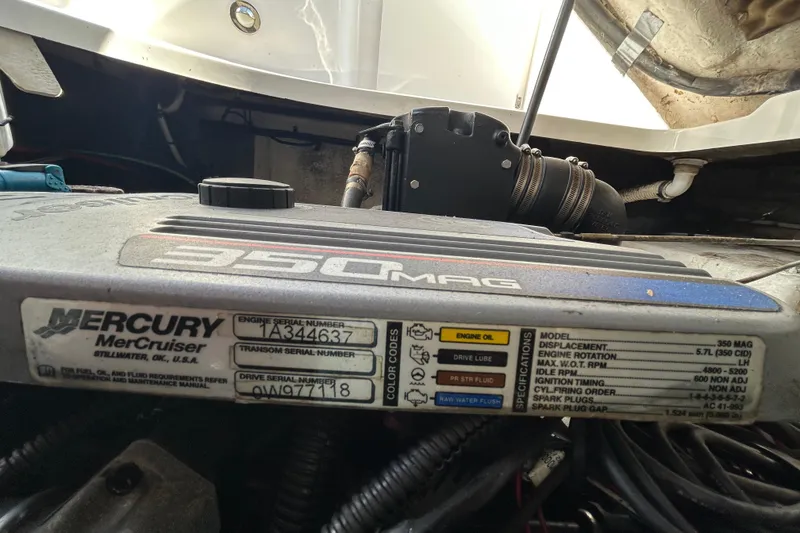 Slide: The Image of Engine compartment of a 2010 Sea Ray Sundancer 260 boat, showcasing mechanical components. - 53