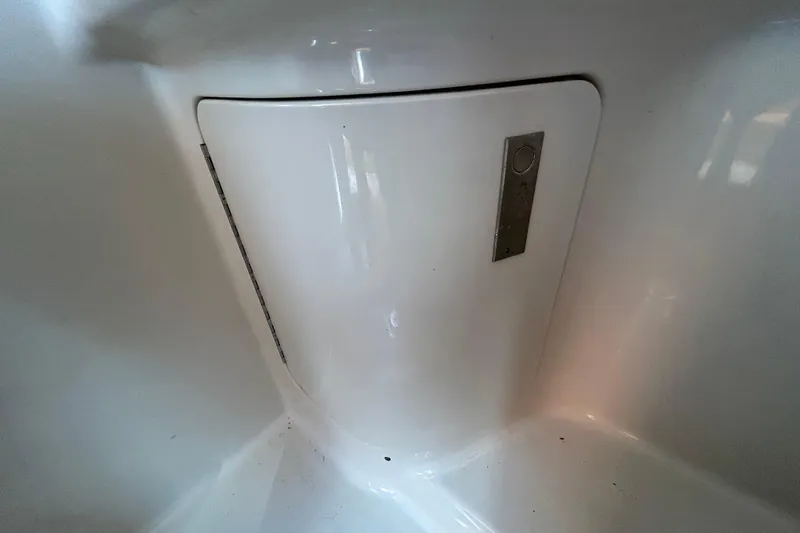 Slide: The Image of Engine compartment of a 2010 Sea Ray Sundancer 260 boat, featuring a MerCruiser 350 engine. - 55