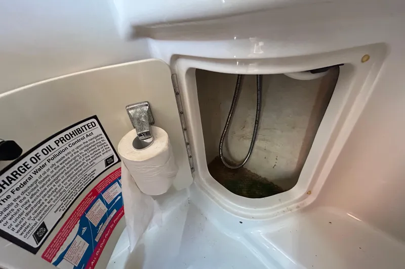 Slide: The Image of Electrical system of a 2010 Sea Ray Sundancer 260 boat, featuring batteries and wiring. - 56