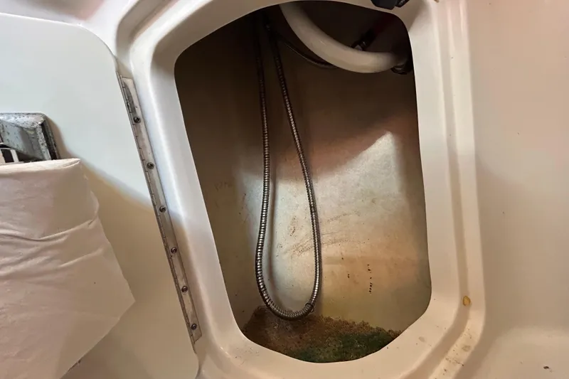 Slide: The Image of Engine compartment of 2010 Sea Ray Sundancer 260 with batteries and wiring. - 57