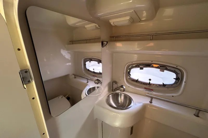 Slide: The Image of Stainless steel sink and cup holders on 2010 Sea Ray Sundancer 260 boat. - 60