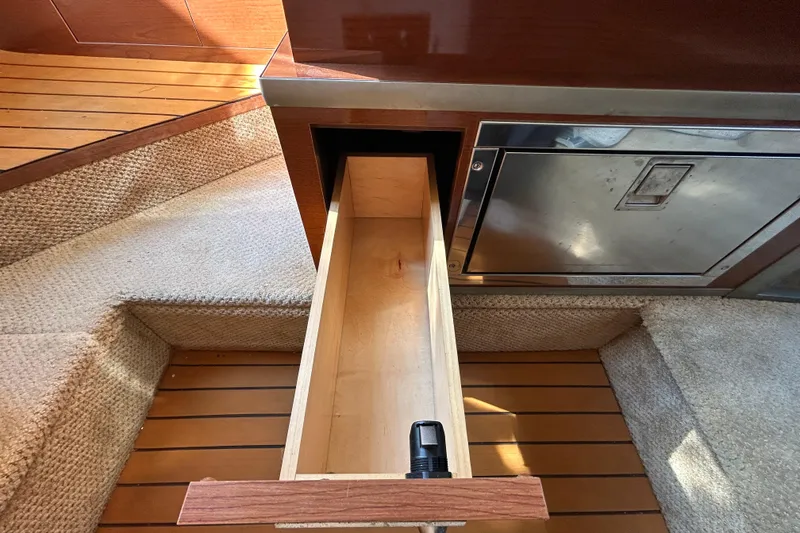 Slide: The Image of Dashboard of a 2010 Sea Ray Sundancer 260 boat with steering wheel and gauges. - 67