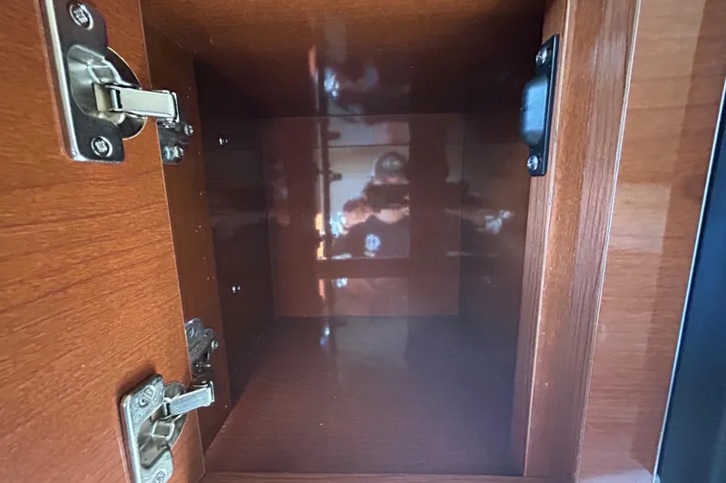 Slide: The Image of Electrical wiring and fuse box inside a 2010 Sea Ray Sundancer 260 boat. - 77