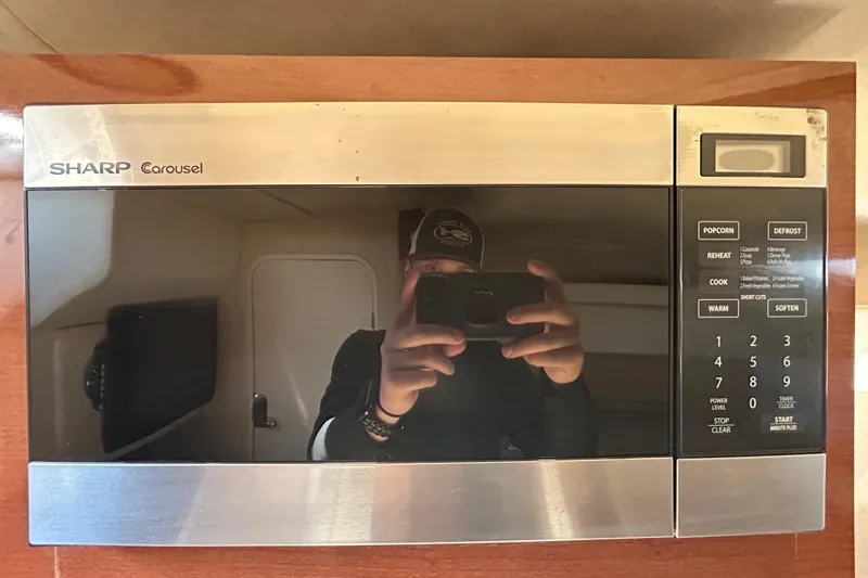 Slide: The Image of White leather seating on a 2010 Sea Ray Sundancer 260 boat. - 78