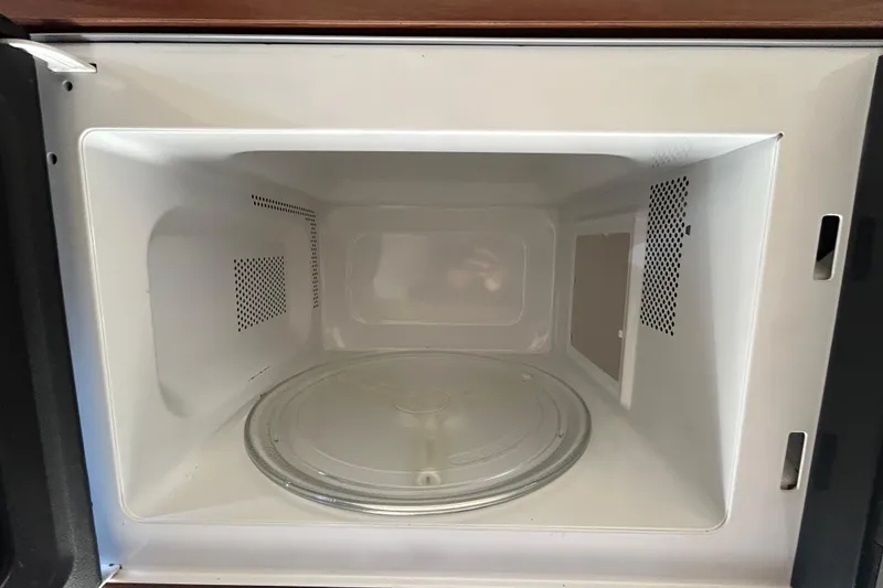 Slide: The Image of White leather seating on a 2010 Sea Ray Sundancer 260 boat. - 80