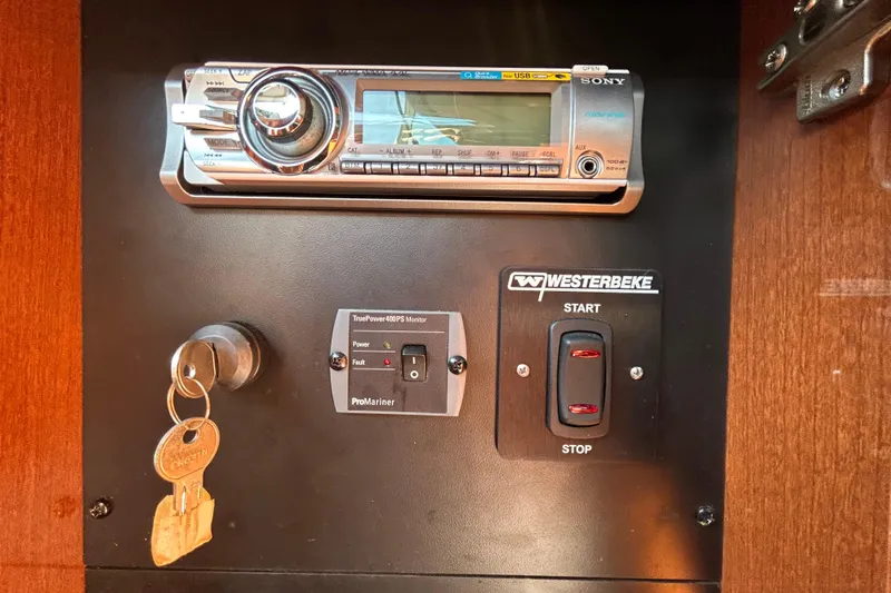 Slide: The Image of Storage compartment with marine cooler inside a 2010 Sea Ray Sundancer 260 boat. - 84