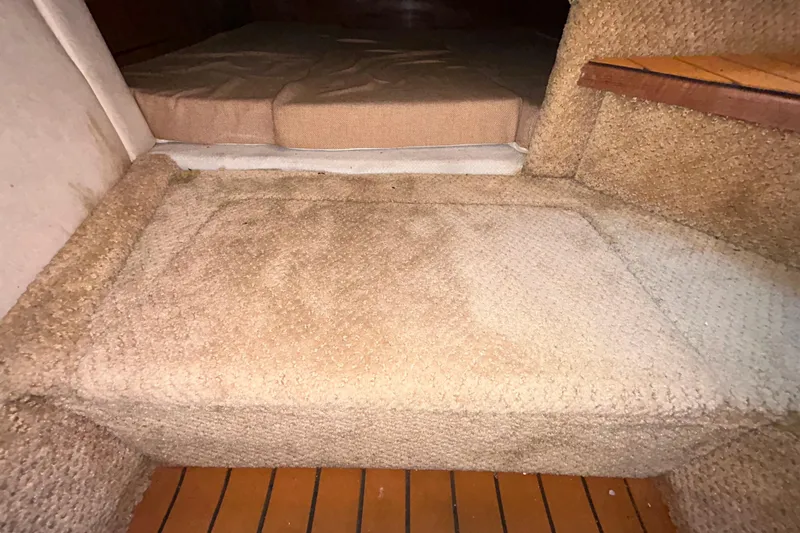 Slide: The Image of Interior view of a 2010 Sea Ray Sundancer 260 boat with open storage compartment. - 94