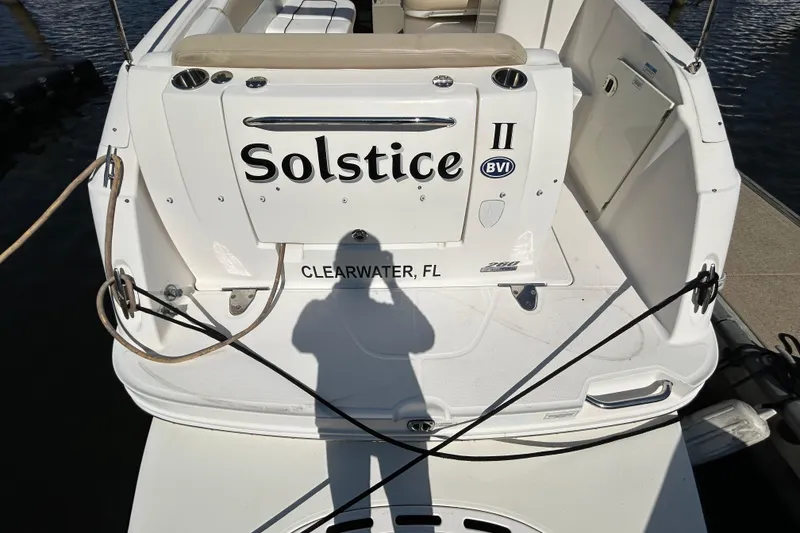 Slide: The Image of Interior cabin of 2010 Sea Ray Sundancer 260 with beige cushions and wood accents. - 97