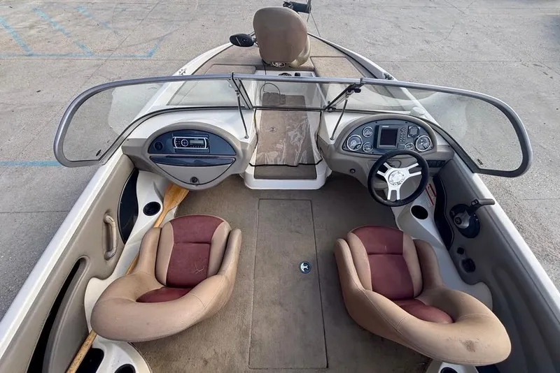 Slide: The Image of 2008 Ranger 180 Reata boat interior with dual seats and dashboard controls. - 13