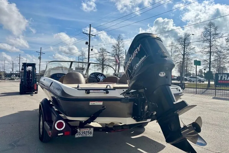 Slide: The Image of 2008 Ranger 180 Reata boat with Mercury engine on trailer, parked outdoors. - 5