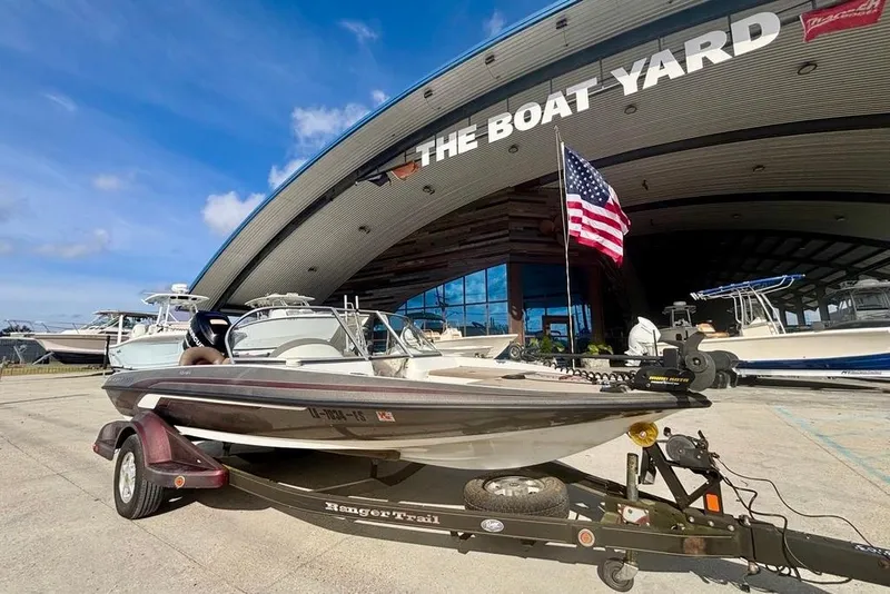 Slide: The Image of 2008 Ranger 180 Reata boat on trailer at The Boat Yard with American flag. - 9