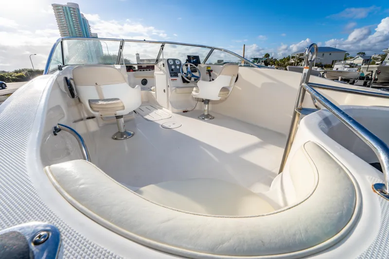 Slide: The Image of 2008 Wellcraft 180 Sportsman boat interior with white seating and steering wheel. - 14