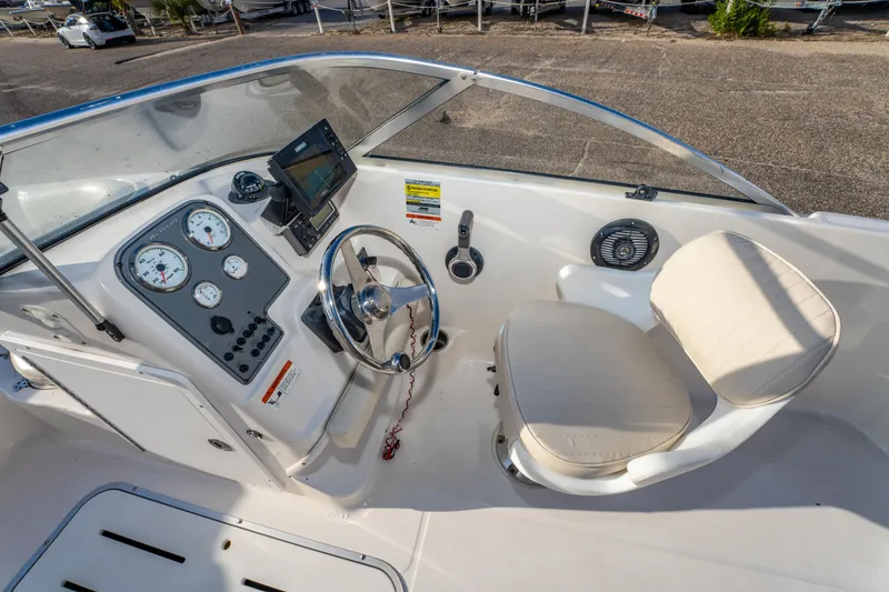 Slide: The Image of 2008 Wellcraft 180 Sportsman boat cockpit with steering wheel and gauges. - 17