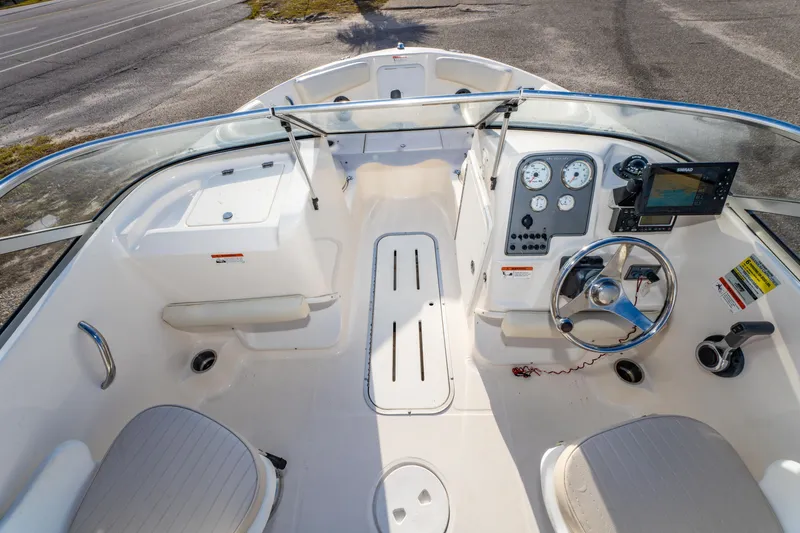 Slide: The Image of 2008 Wellcraft 180 Sportsman boat interior with steering wheel, gauges, and seating. - 20