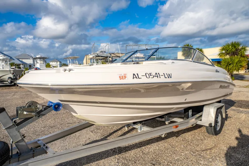 Slide: The Image of 2008 Wellcraft 180 Sportsman boat on trailer under a partly cloudy sky. - 9
