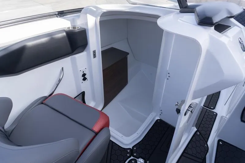 Slide: The Image of 2026 Scarab 255 LX Wake boat interior with seating and storage compartment. - 19