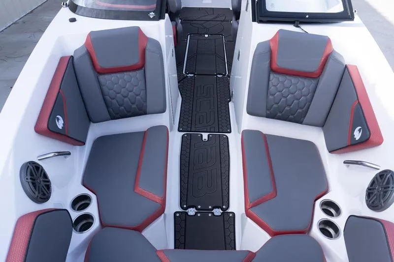 Slide: The Image of 2026 Scarab 255 LX Wake boat interior with gray and red seating, modern design. - 22