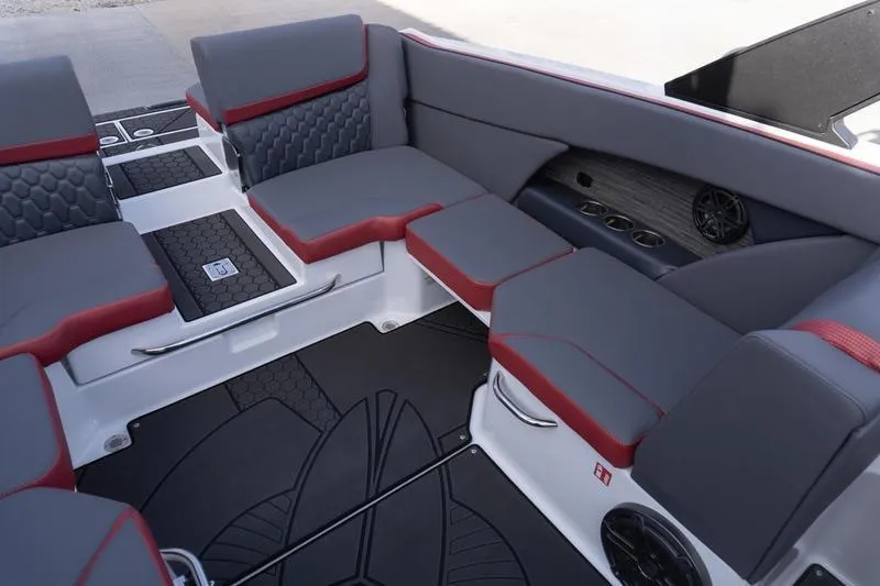 Slide: The Image of Interior of 2026 Scarab 255 LX Wake boat with gray and red seating. - 27