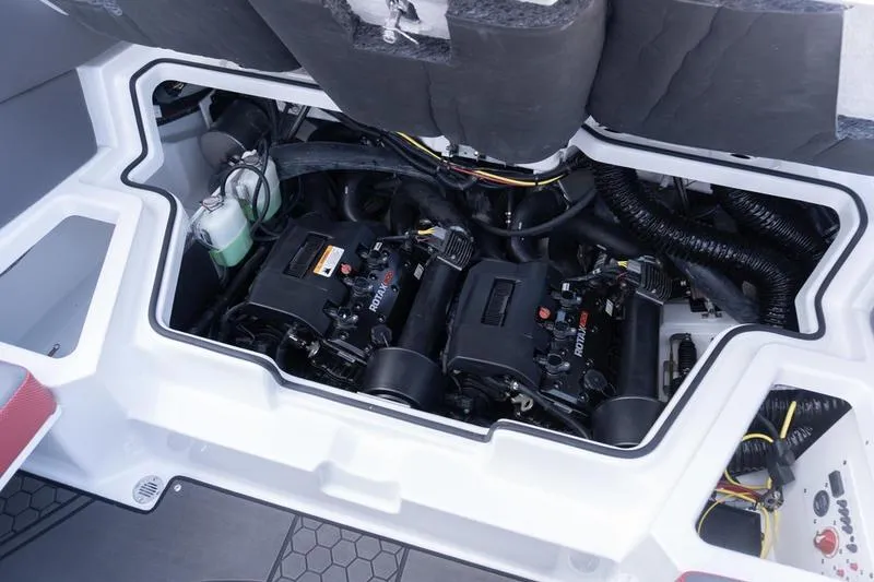 Slide: The Image of Engine compartment of 2026 Scarab 255 LX Wake boat, showcasing dual Rotax engines. - 28