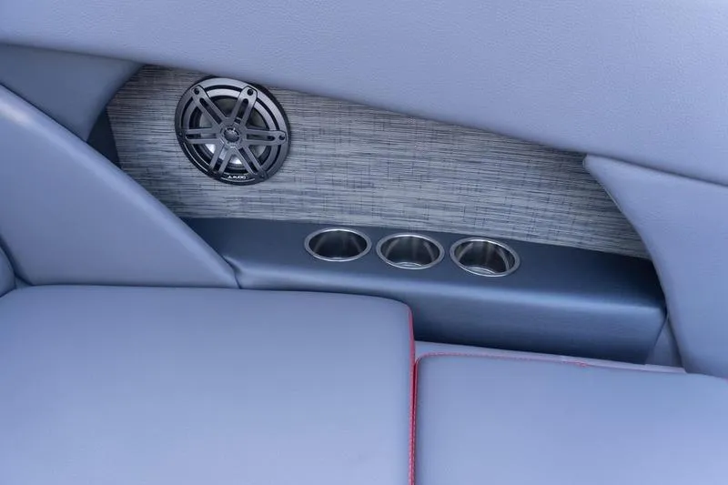 Slide: The Image of Interior of 2026 Scarab 255 LX Wake boat with speaker and cup holders. - 30
