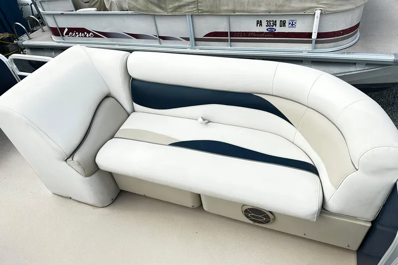 Slide: The Image of 2015 Godfrey 2286 Sweetwater Pontoon with white and navy seating. - 11