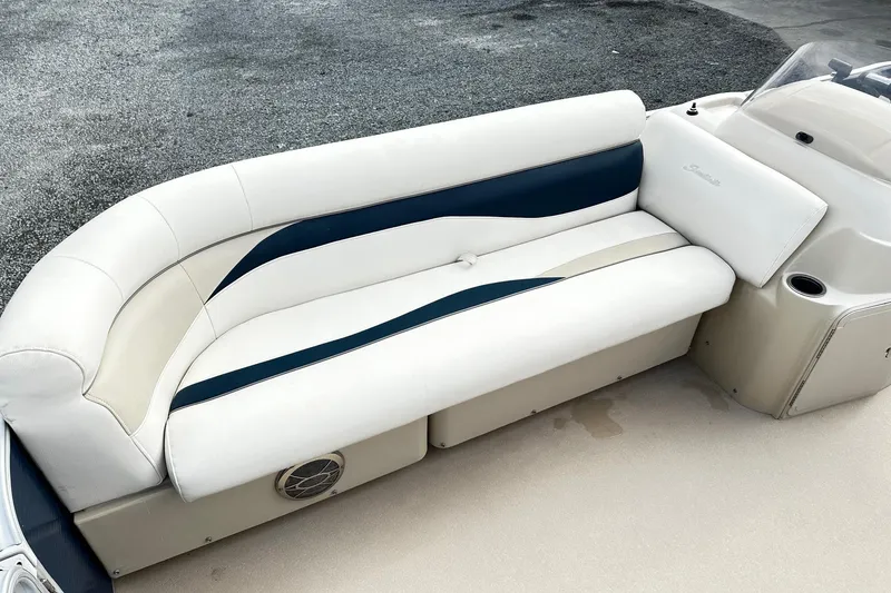 Slide: The Image of 2015 Godfrey 2286 Sweetwater Pontoon boat interior with white and blue seating. - 12