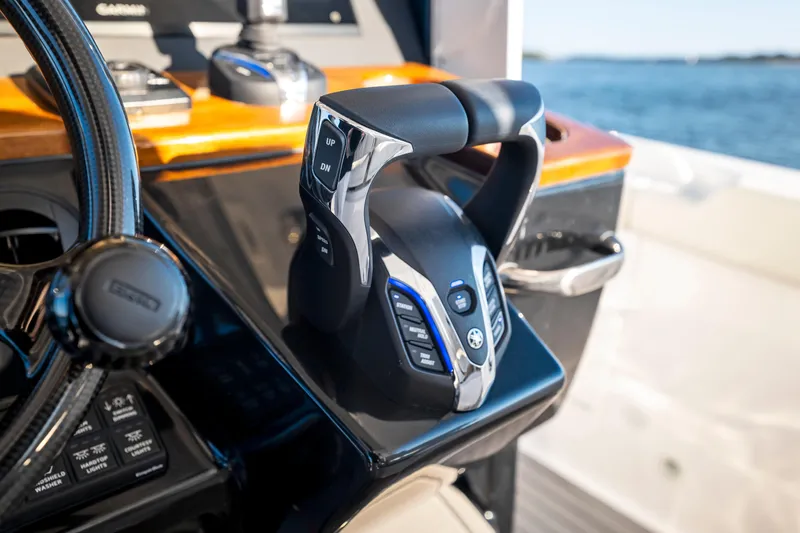 Slide: The Image of 2026 Everglades 375 Center Console boat controls with ocean view. - 14