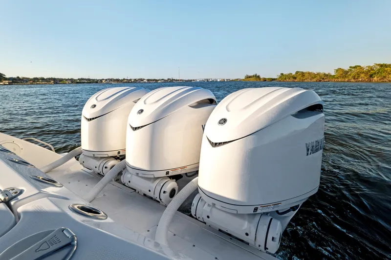 Slide: The Image of 2026 Everglades 375 Center Console with triple outboard engines on water. - 17